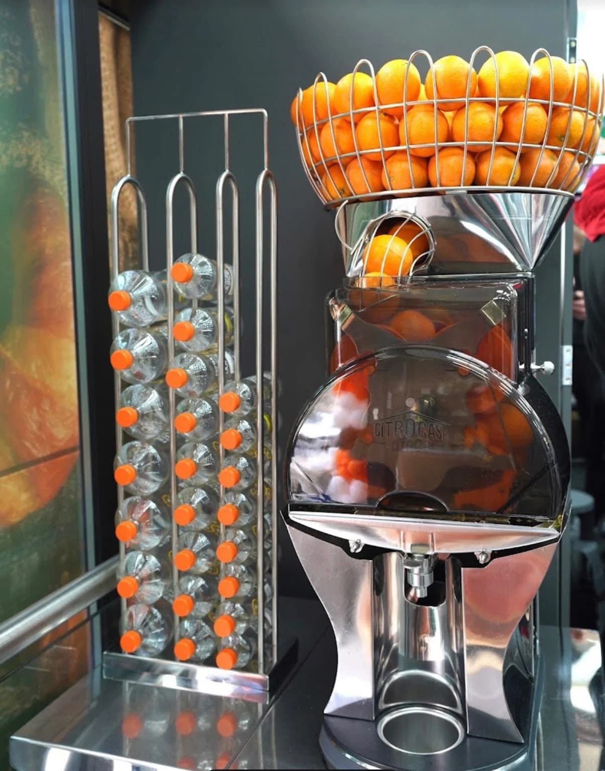 Fresh oranges and juice machine inside Fresh Local Royal Wharf